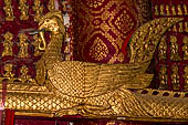 Luang Prabang, Laos - Wat Mai, detail of the wooden trough used for the ceremonial cleaning of Buddha statue. 